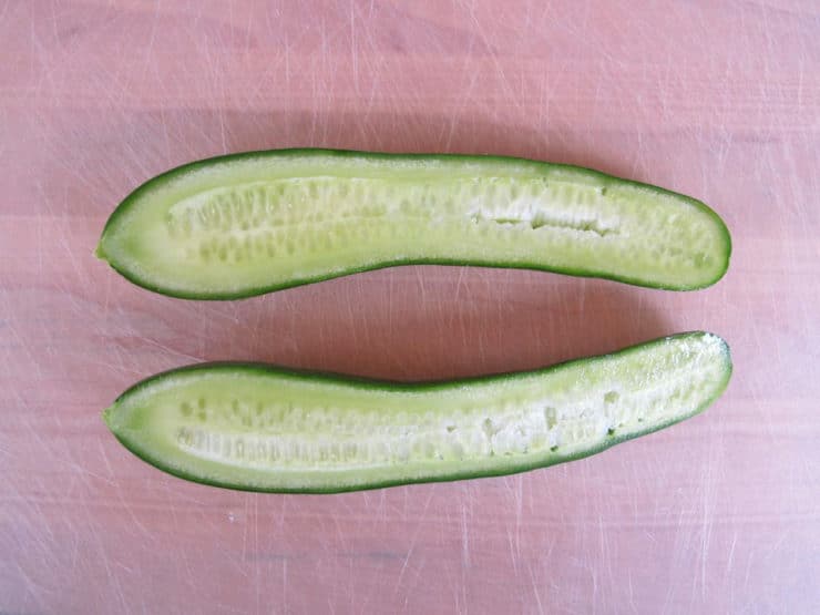 Cucumber sliced in half lengthwise.