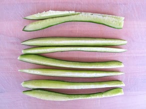 Cucumber sliced lengthwise into 8 pieces.