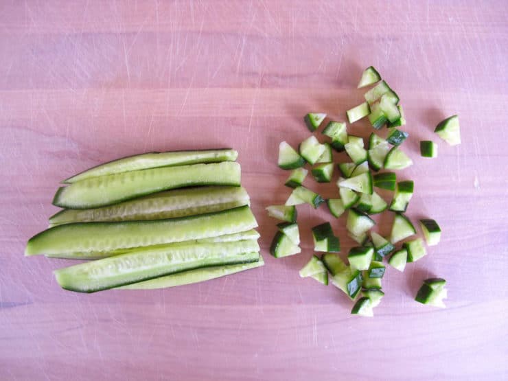 Dicing cucumber strips.