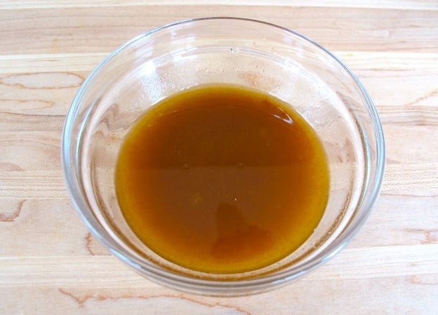 Olive oil dressing in a small bowl.