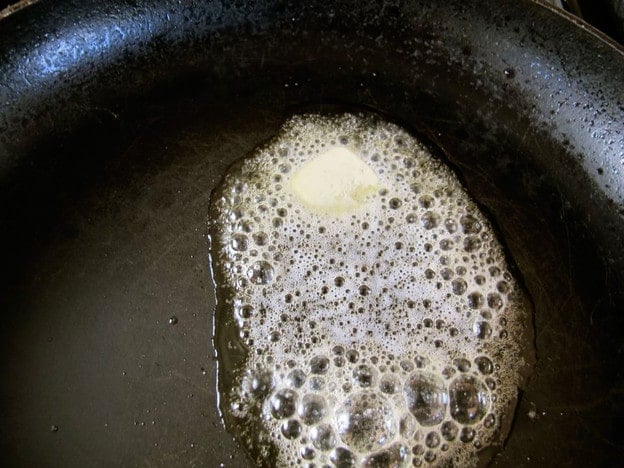 Melting butter in a skillet.