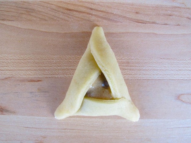 Pinch triangle points together.