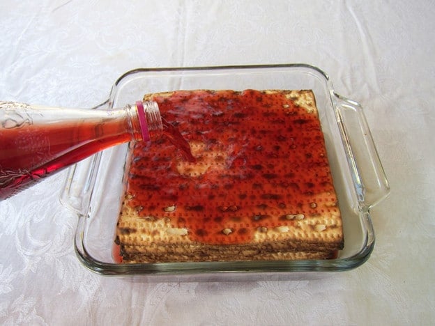 Soaking matzo with wine.