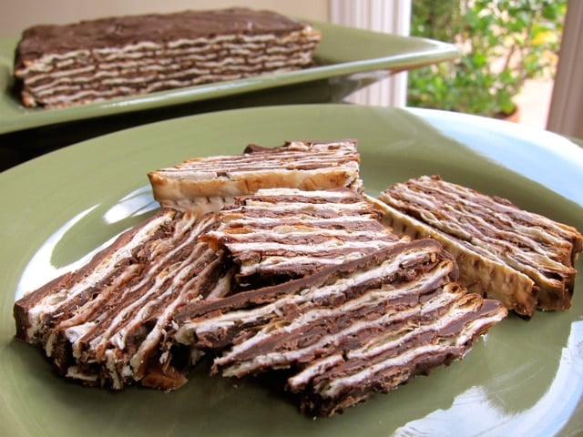 Slices of chocolate Matzo cake made with layers of matzo, chocolate ganache, and whipped cream