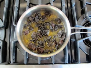 Prune filling simmering in a saucepan.