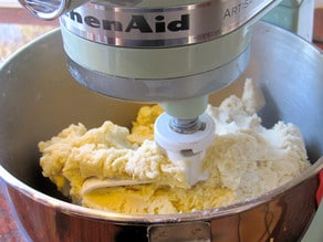 Cookie dough ingredients in a stand mixer.