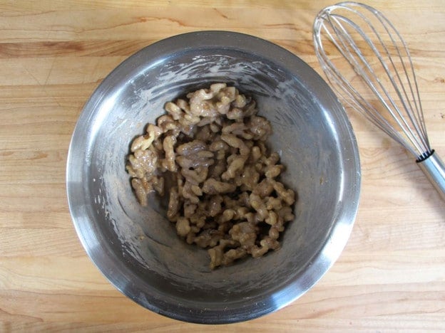 Walnuts coated with egg white.