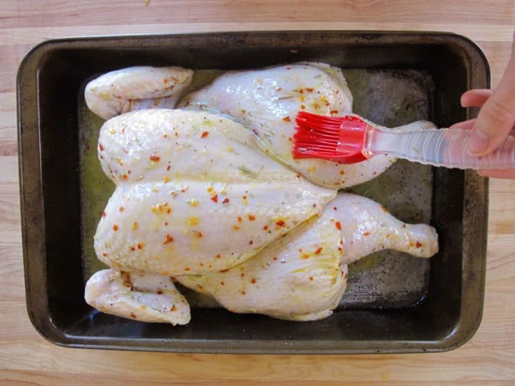 Roast Chicken brushed with lemon butter.