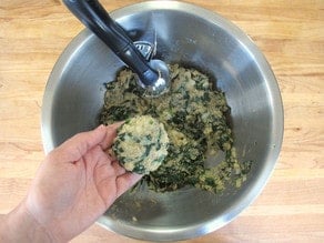 Scooping out spinach patties.