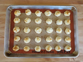 Baked macaroons on a baking sheet.