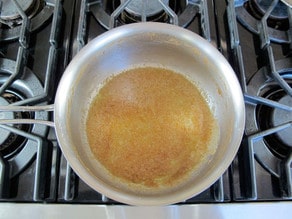 Butter and brown sugar syrup in a saucepan.