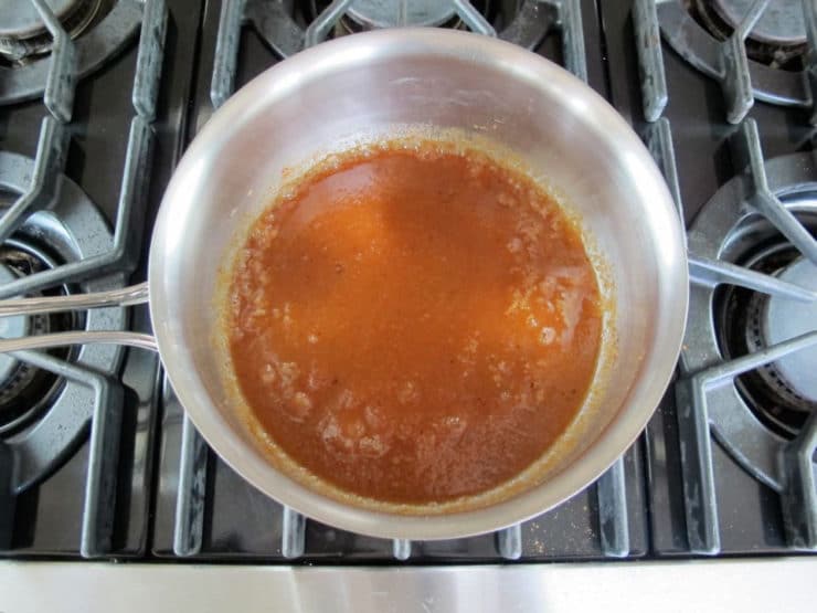 Applesauce, sugar and seasonings in a saucepan.