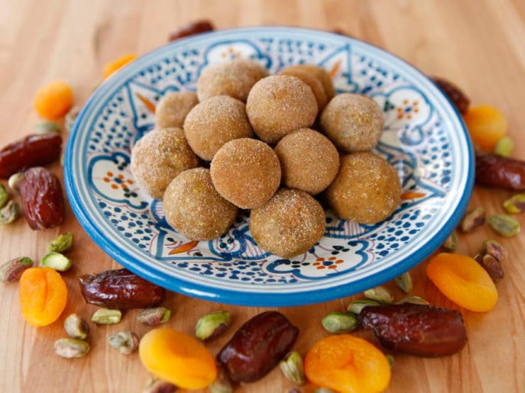 A plate of dates and nuts on wooden table, Sephardic Charoset Truffles
