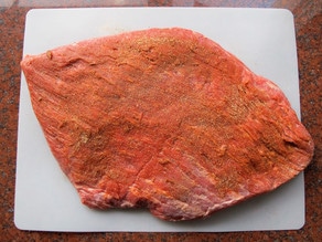 Beef brisket rubbed with spices.