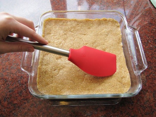 Tishpisthi Dough flattened into a baking dish.