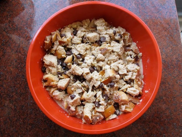 Bread cubes soaking in wet ingredients.
