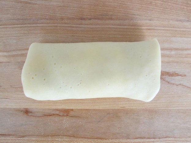 Blintz rolled up around cheese filling.