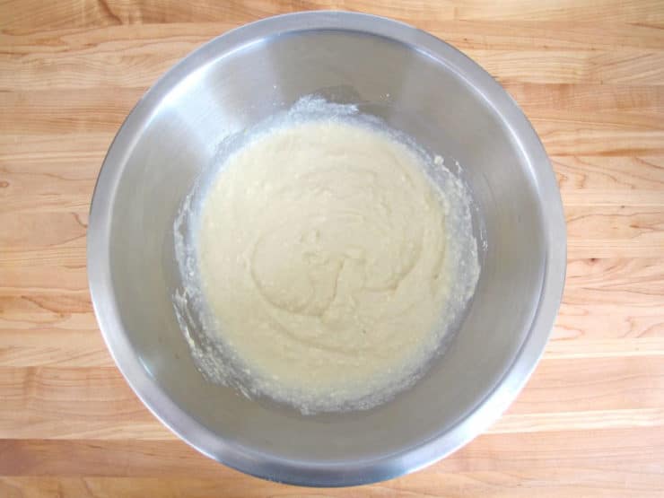 Strained ricotta in a mixing bowl.