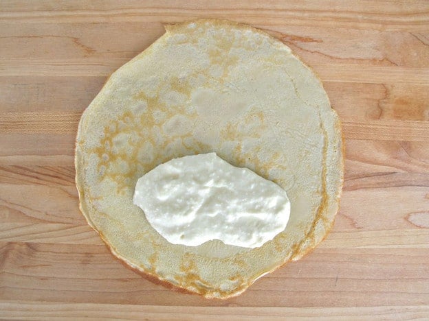 Ricotta filling on a blintz.