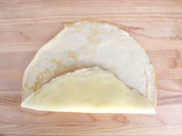 One edge of blintz folded up over filling.
