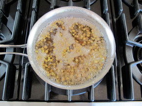 Lentils cooking in a saucepan.