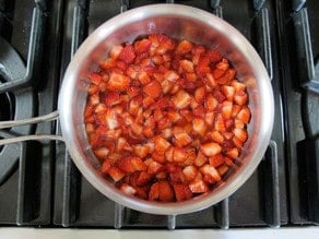 Diced strawberries in a saucepan.