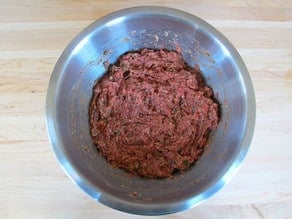 Meat mixture completely mixed in a bowl.