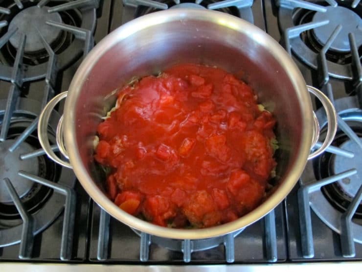 Tomato sauce poured over meat and cabbage.