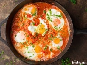 Eggs in tomato sauce in a skillet, traditional Shakshuka dish