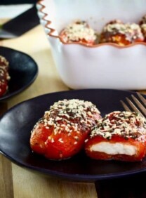 Stuffed Peppers with Goat Cheese - Recipe for roasted bell peppers filled with soft goat cheese, topped with herbs and baked.