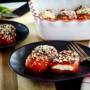 Stuffed Peppers with Goat Cheese - Recipe for roasted bell peppers filled with soft goat cheese, topped with herbs and baked.