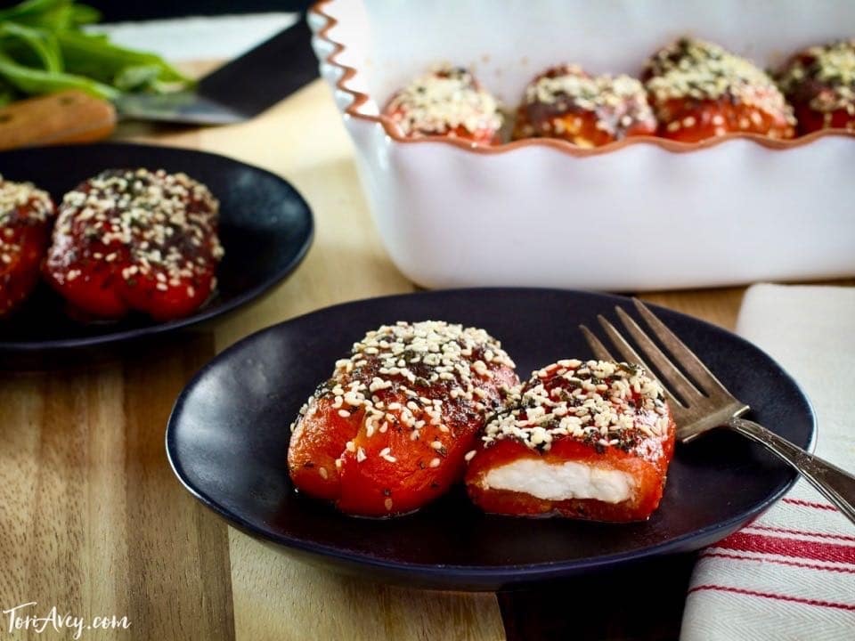 Stuffed Peppers with Goat Cheese - Recipe for roasted bell peppers filled with soft goat cheese, topped with herbs and baked.