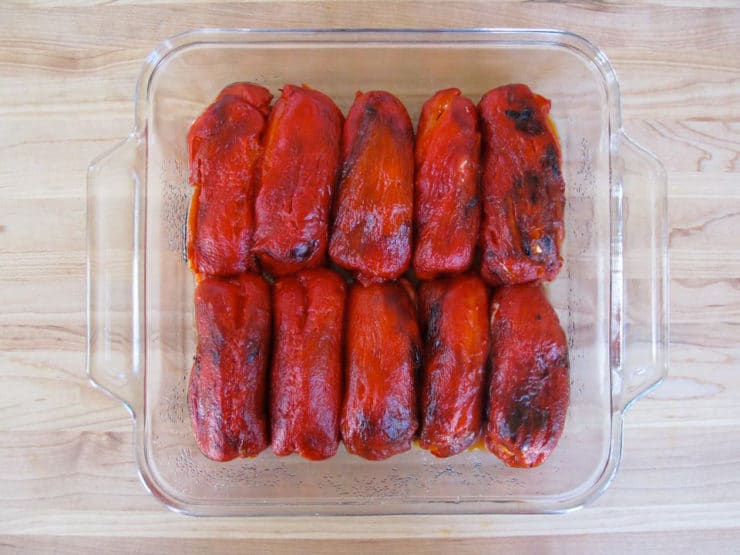 Goat cheese stuffed peppers in a baking dish.