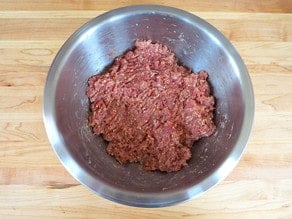 Ground beef in a mixing bowl.