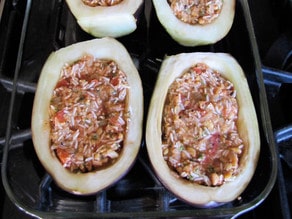 Eggplant halves filled with stuffing.