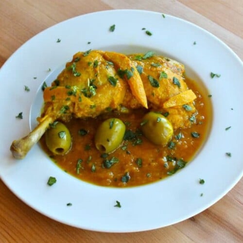 A traditional Moroccan dish featuring tender chicken cooked with tangy lemon and briny olives