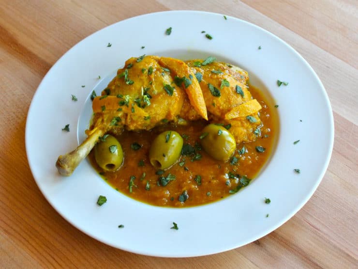 A traditional Moroccan dish featuring tender chicken cooked with tangy lemon and briny olives