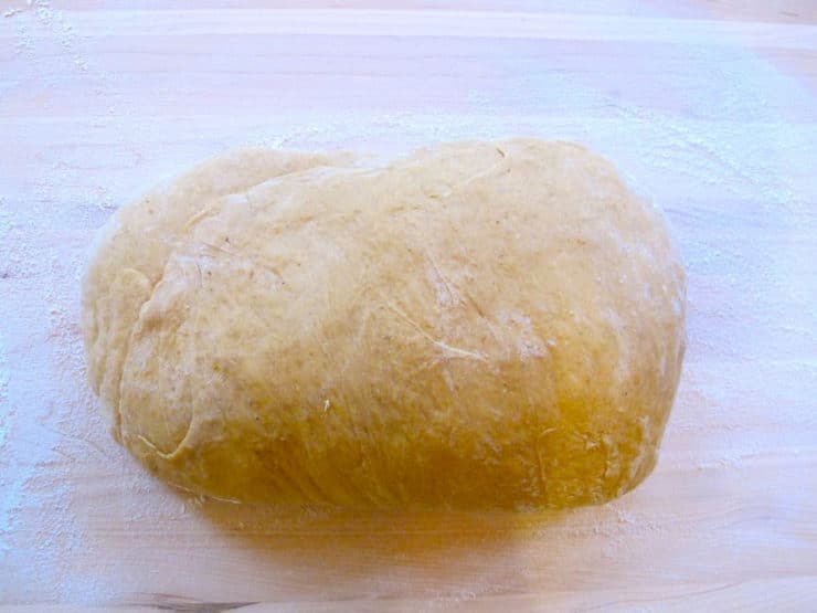 Smooth challah dough roll.