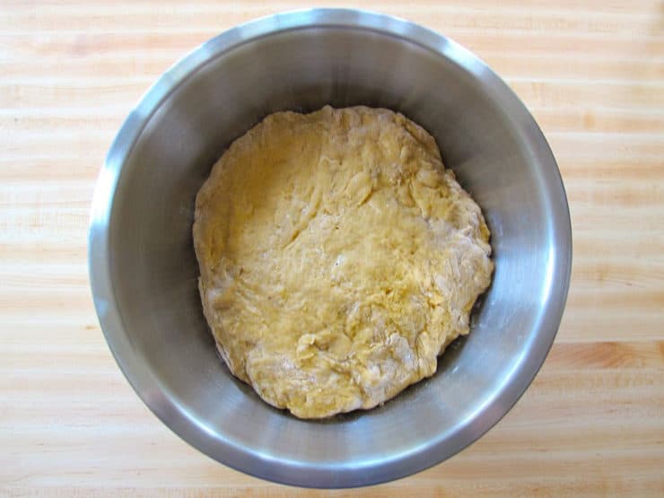 Soft challah dough in a bowl.