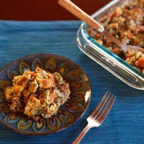 Challah Chestnut Stuffing on a plate with a fork on the side