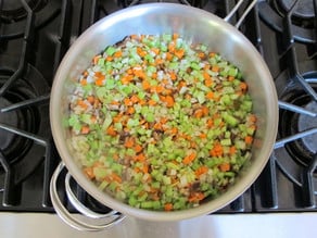 Carrots and celery in a skillet.