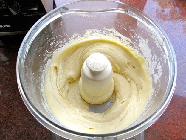 Cheese latke ingredients in a food processor.