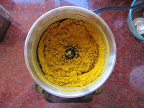 Blended powdered spices in coffee grinder.