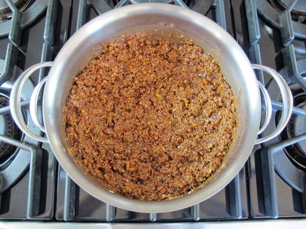 Stir oats into peanut butter mixture in a saucepan.
