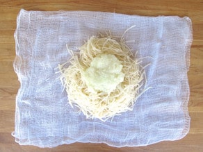 Drained potatoes on cheesecloth.