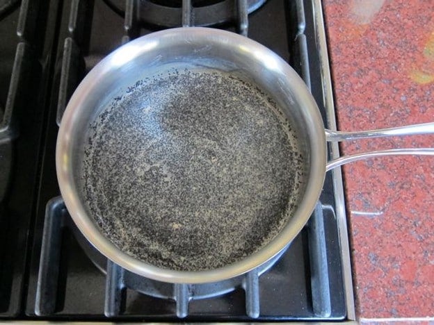 Soaking poppyseeds in water.