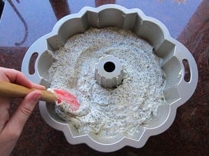 Smoothing cake batter into bundt pan.