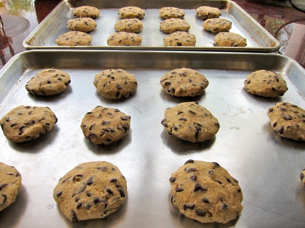 Chocolate chip cookie dough on ungreased baking sheets.