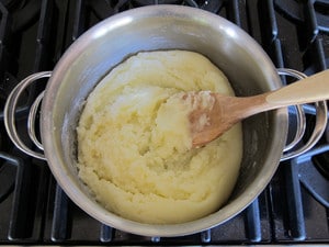 Powdered sugar stirred into melted butter in a saucepan.