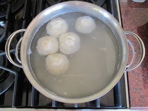 Cooking potato balls in hot water.
